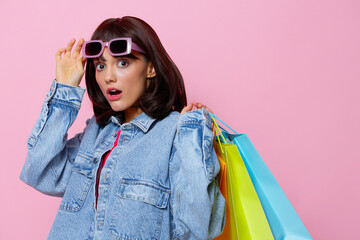 portrait woman in denim jackets with colorful shopping bags Lifestyle fashion