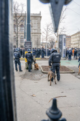 policemen at a demonstration with dogs