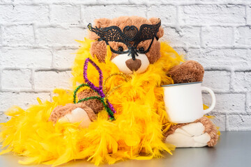 Mardi Gras Mockup, Empty blank white coffee mug and Teddy bear in mask and boa. Mardi Gras party...