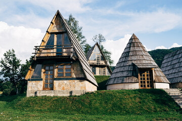 Fototapeta na wymiar Stone triangular and conical houses in the north of Montenegro