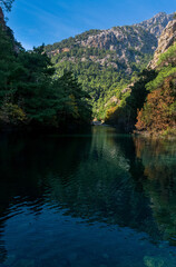 Fototapeta na wymiar autumn mountain landscape with shady lake