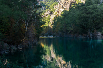 autumn mountain landscape with shady lake