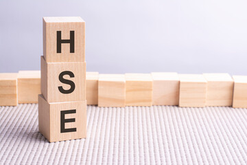 business conceptual word collected of wooden elements with the letters. HSE written in wooden cubes.