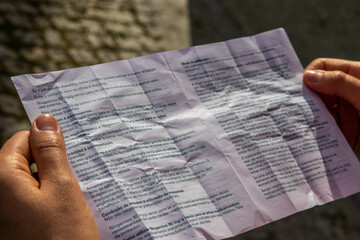 woman reads package insert for the medicine she just bought