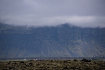 Green Grassy mountain Landscape in the highlands. Travel and nature on a beautiful cold day