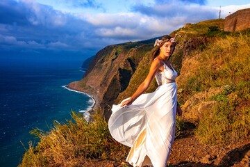 woman in a wedding dress in the mounatins from madeira portugal 