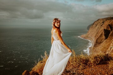 woman in a wedding dress in the mounatins from madeira portugal 