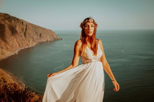 woman in a wedding dress in the mounatins from madeira portugal 