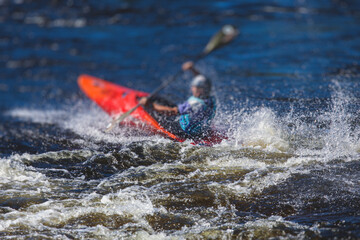 Kayak slalom canoe race in white water rapid river, process of kayaking competition with colorful canoe kayak boat paddling, process of canoeing with big water splash