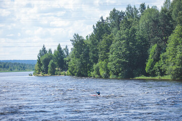 Kayak slalom canoe race in white water rapid river, process of kayaking competition with colorful...