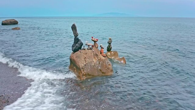 Serenity and tranquility in nature background. Stones and rocks on sea shore
