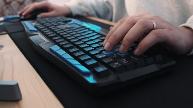 Colorful backlit Gaming Keyboard Gamer Typing WASD Close Up with illuminated vivid color shift. High quality 4k footage