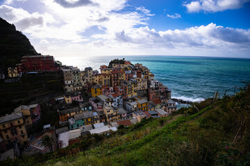 Fototapeta na wymiar The colorful houses of Manarola in Cinque Terre at the Italian coast - travel photography
