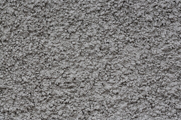 Painted plastered wall. Rough surface. Wall texture for background and design. Closeup.