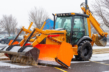snow plow clears the streets during a snow storm