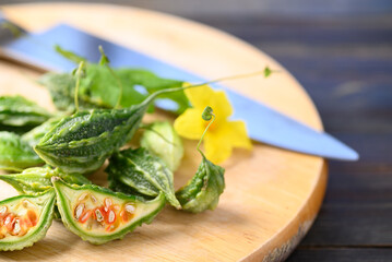 Small bitter gourd or bitter melon on cutting wooden board, Food ingredients and herbal medicine