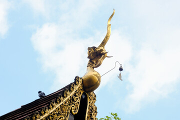 Fototapeta na wymiar Gable apex architecture of golden buddha of Chet Yot Temple, Chiang Mai, Thailand.