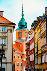 Obraz premium Colorful Buildings with Clock Tower of Royal Castle in old town Warsaw, Poland