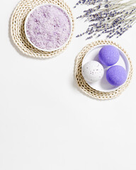 Obraz na płótnie Canvas Lavender bath bombs and sea salt with dried lavender flowers, fragrant and healthy spa products with essential oil. Aromatherapy and herbal medicine, cosmetic for body treatment