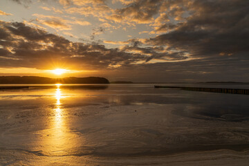 Obraz premium Sunset over the Jasmunder Bodden coast in Lietzow, Mecklenburg-Western Pomerania, Germany