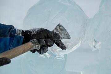 Sculptor's hands at work with a chisel