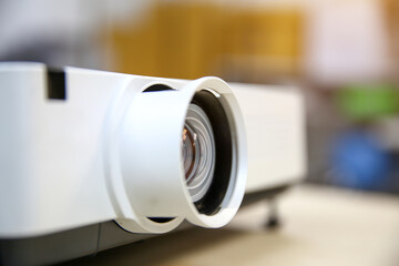 Close-up computer projector on table boardroom or meeting room technology equipment of visual or...