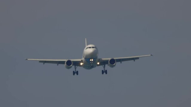 Aircraft telephoto scene of twin engine jet airliner on approach - Koh Samui island - Thailand
