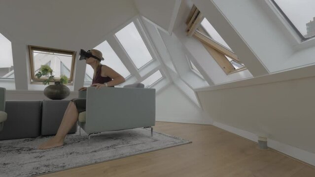 Woman entertaining with VR-headset in Cube House