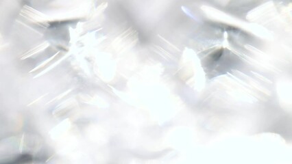 Sparkling diamond highlights backdrop. Light passes thru prism creating repeating light sparks. Dreamy, defocused glass refraction overlay