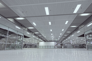 Wide-angle of empty area and architectural structure in new subway station or airport terminal. Concept of modern interior design and transportation