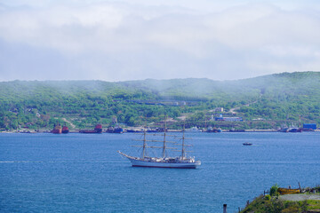 Seascape with a sailboat in the bay of Vladivostok