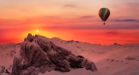 Dramatic Mountain Landscape covered in clouds and Hot Air Balloon Flying. 3d Rendering Adventure Dream Concept Artwork. Aerial Image from British Columbia, Canada. Sunset or Sunrise Sky