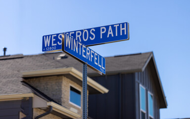 Obraz premium Street sign in San Antonio, Texas with the names of the streets Westeros path and Winterfell being inspired from famous TV show. Die hard fans of movies name streets after fictional locations