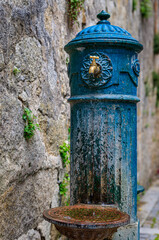 Fototapeta na wymiar Antique water pump in a courtyard in Porto, Portugal