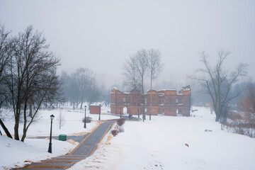 Ruins of an old Red Mill in Loshitsa park of Minsk city at winter time