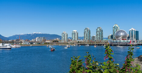 Vancouver, BC, Canada - April 16 2021 : Vancouver marina, False Creek, modern buildings skyline in...