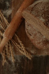Fototapeta premium Half of rye bread. Wheat, bread, flour. vertical photo