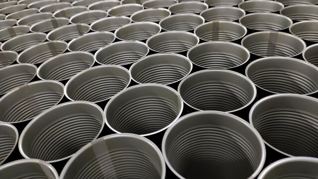 pattern from clean empty can arrangement in the production room of factory