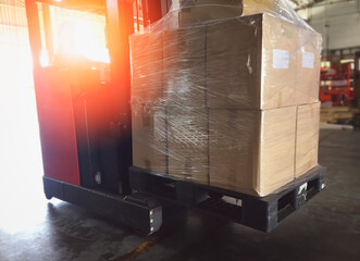 Electric Forklift Pallet Jack Unloading Packaging Boxes in The Warehouse. Storage Warehouse Shipment Boxes. Cargo Supply Chain. Shipping Cargo Import - Export.	
