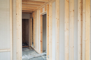 Obraz na płótnie Canvas Interior passage in a new build timber house under construction