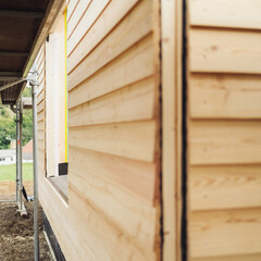 View down the length of a prefabricated wooden wall on new build