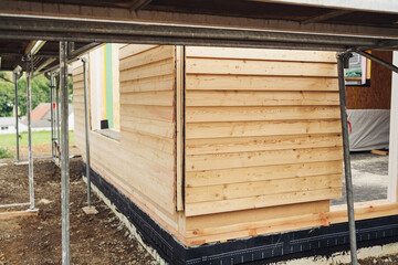 Wooden board cladding on a prefabricated new build house