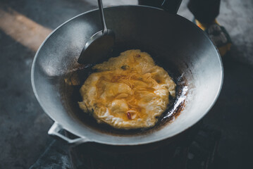 Thai style omelet in Thai street food restaurant