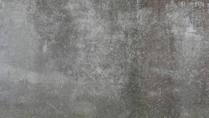 The old cement wall was weathered, the surface was scratched, the surface was scratched and damaged. For a mysterious retro-conservative background.