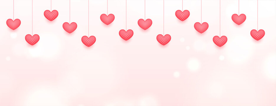 hanging love hearts on pink bokeh banner design