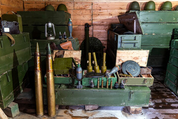 various types of ammunition and military equipment in basement. - obrazy, fototapety, plakaty
