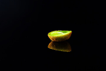 kiwi fruit on black background