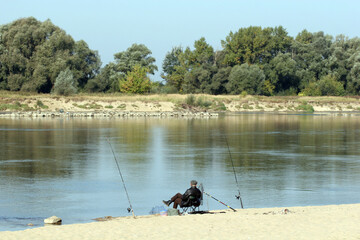 Obraz na płótnie Canvas Anglers on the Vistula River, near Karczew, Poland, Europe
