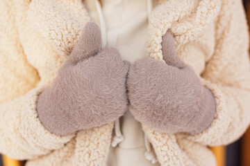 Warm womens mittens and faux fur coat. Beautiful polyester clothes