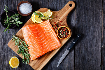Fresh salmon fish fillet on wooden board